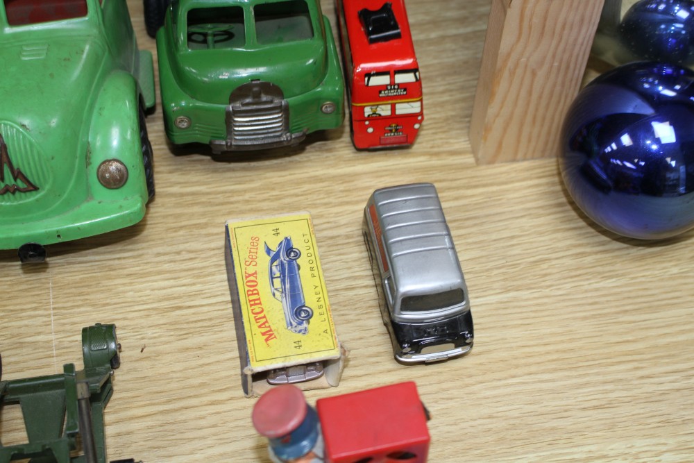 A group of assorted tinplate and diecast toys